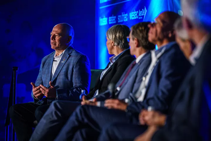 John Dyck speaking on a panel at a conference