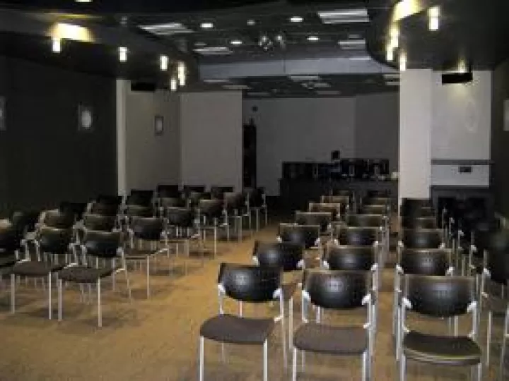 Chairs arranged in rows "theater-style"