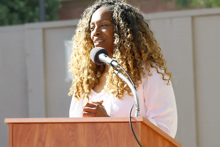 Davida Johnson at an outdoor podium