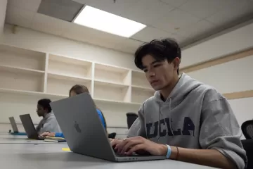 A student using a laptop for accessibility testing