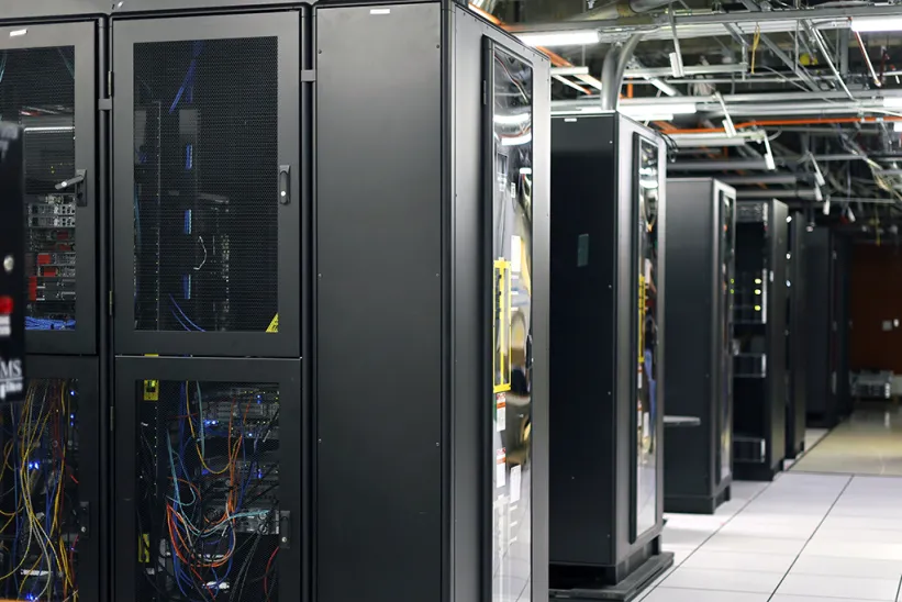 A server room with rows of server racks.