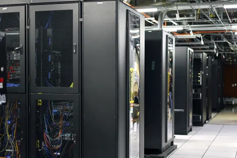 A server room with rows of server racks.